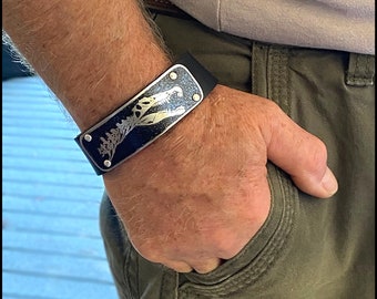 Spinosaurus Neck and Skull Etched in German Silver riveted to a Leather Cuff Bracelet