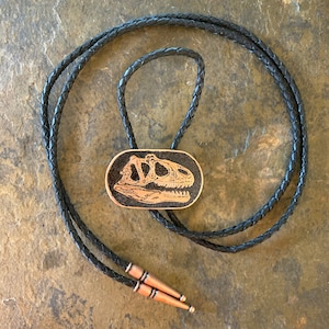 Etched and Colored Copper Allosaurus Skull Bolo Tie