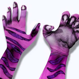 May include: Two pink hands with purple stripes and claws. The hands are posed with fingers extended and curled. The hands are against a white background.