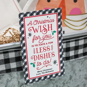May include: A Christmas wish card with a black and white checkered background. The card says "A Christmas Wish for you is to have a few less dishes to do!" and "Merry Christmas! Love, The McKowns".