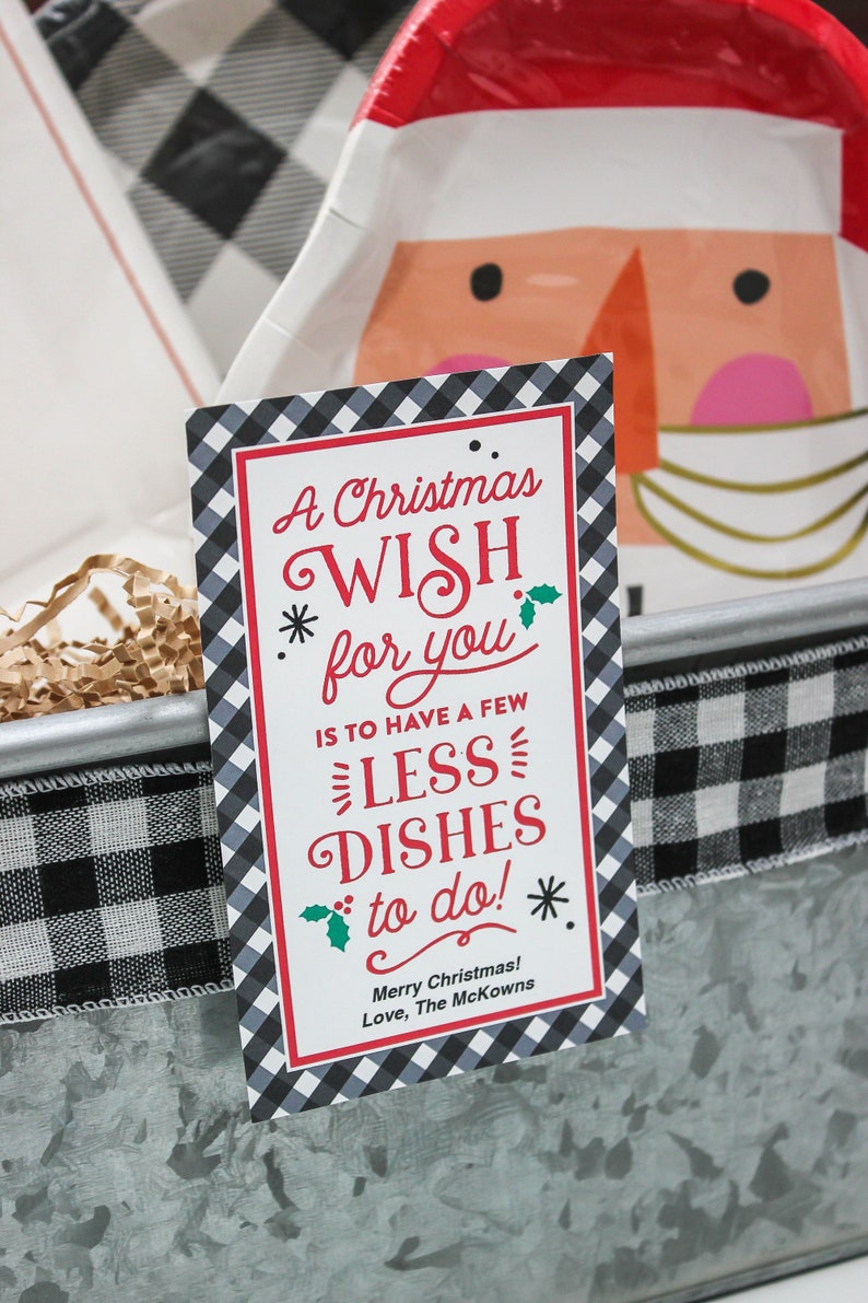 May include: A Christmas wish card with a black and white checkered background. The card says "A Christmas Wish for you is to have a few less dishes to do!" and "Merry Christmas! Love, The McKowns".