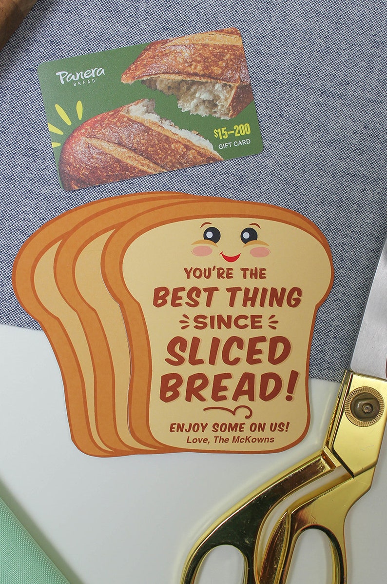 May include: A brown and yellow card shaped like a slice of bread with the text "You're the best thing since sliced bread!" and "Enjoy some on us! Love, The McKowns".