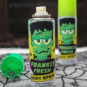 May include: Two green and yellow spray bottles with a Frankenstein monster graphic and the text "Frankly Fresh Body Spray" and "Happy Halloween! Love, Sawyer & Easton".