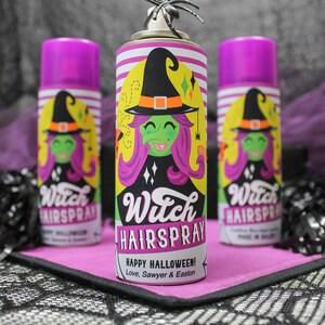 May include: Three purple and yellow spray bottles with a witch graphic and the text "Witch Hairspray! Happy Halloween! Love, Sawyer & Easton".