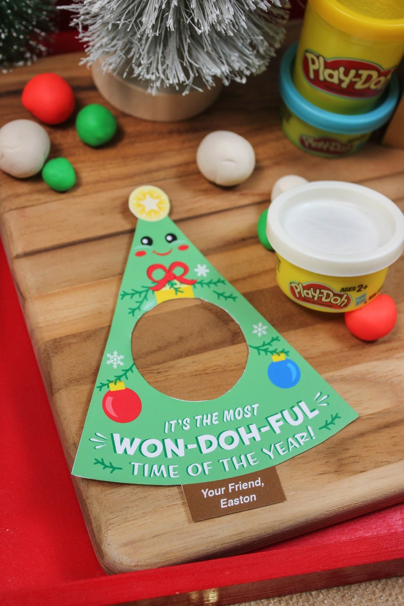 May include: A green Christmas tree-shaped card with the text "It's the most Won-Doh-Ful Time of the Year!" and a brown tag with the text "Your Friend, Easton".