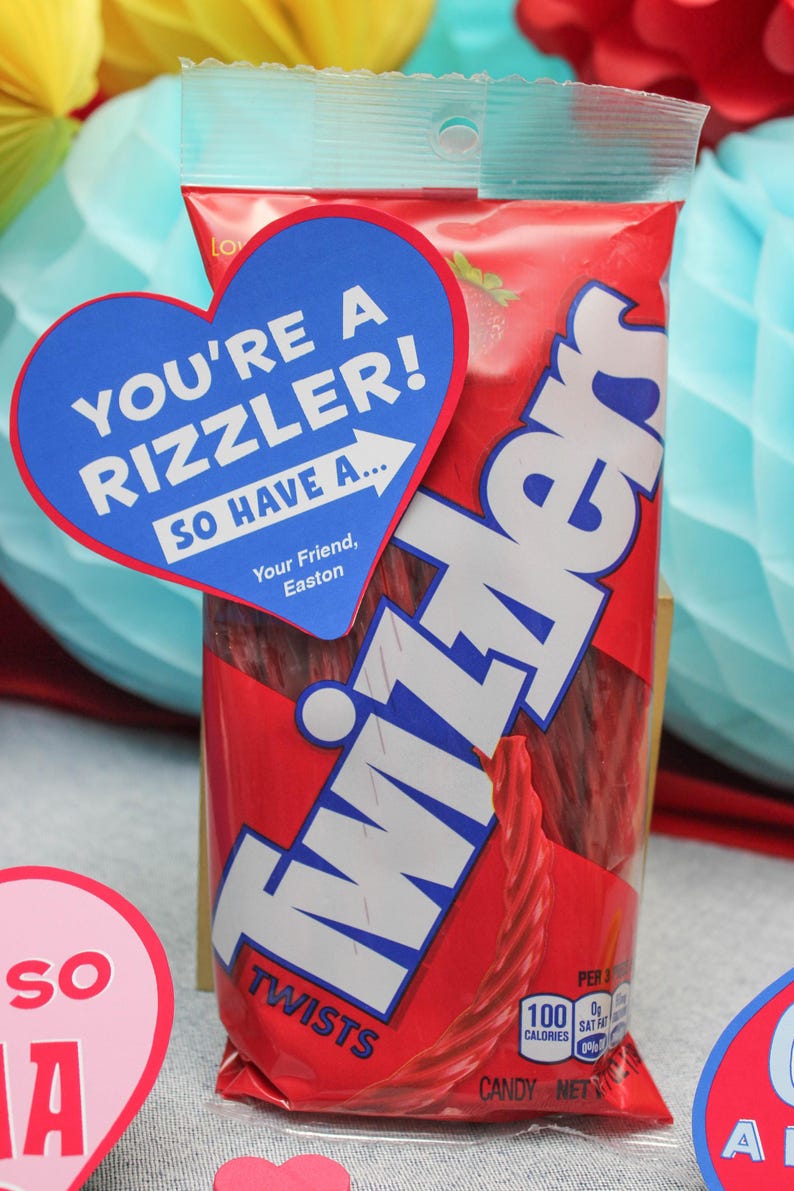 May include: A red bag of Twizzlers candy with a blue heart-shaped tag that says "You're a rizzler! So have a... Your Friend, Easton".