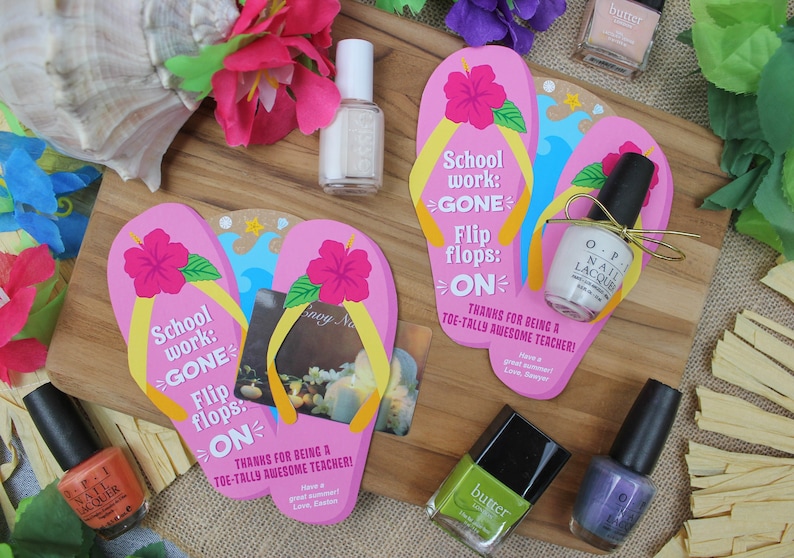 May include: Two pink and yellow flip-flop shaped cards with the text "School work: GONE Flip flops: ON" and "Thanks for being a TOE-TALLY AWESOME TEACHER!"  The cards are surrounded by various bottles of nail polish, seashells, and flowers.