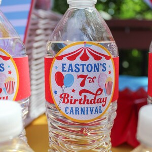 May include: Clear plastic water bottle with a red, white, and blue circus-themed label that says "Easton's 7th Birthday Carnival".