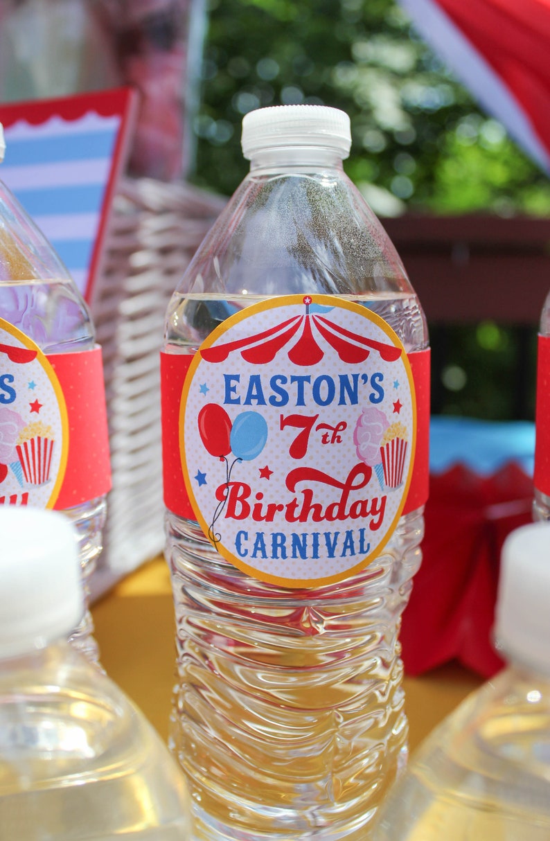 May include: Clear plastic water bottle with a red, white, and blue circus-themed label that says "Easton's 7th Birthday Carnival".