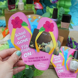 May include: Pink and yellow flip-flop shaped card with the text "School work: GONE Flip flops: ON" and the message "Thanks for being a toe-tally awesome teacher!"