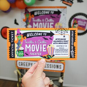 May include: Orange and purple Halloween movie ticket with a witch and monster illustration. The ticket reads "Welcome to Thrills & Chills Movie Theater".