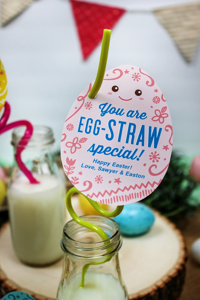 May include: A pink and white egg-shaped card with the text "You are EGG-STRAW special!" and "Happy Easter! Love, Sawyer & Easton". A green straw is attached to the card and is inserted into a glass bottle.