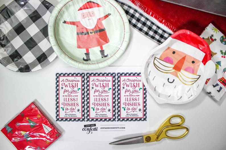 May include: Three printable Christmas gift tags with a black and white plaid background. The tags feature a red and green Christmas wish that says "A Christmas Wish for you is to have a few less dishes to do!"