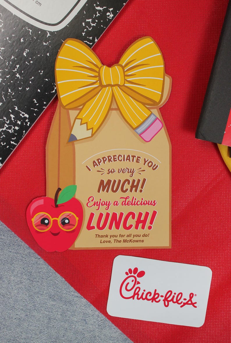 May include: A brown paper lunch bag with a yellow bow and a pencil sticking out of the top. The bag has a message that says "I appreciate you so very much! Enjoy a delicious lunch!" and "Thank you for all you do! Love, The McKowns". There is a red apple with a smiling face and glasses next to the bag. A Chick-fil-A gift card is in the bottom right corner.