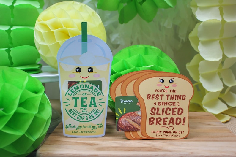 May include: Two gift cards with a fun design. One card features a cartoon lemonade or tea cup with the text "Lemonade or Tea the next one's on me!" and "Thank you for all you do! Love, The McKowns". The other card features a cartoon slice of bread with the text "You're the best thing since sliced bread! Enjoy some on us! Love, The McKowns".
