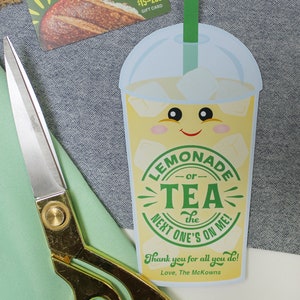 May include: A gift card for Panera Bread with a value of $15-200. The card features a picture of a loaf of bread. A cartoon illustration of a lemonade or tea drink with a smiling face and the text "Lemonade or Tea the next one's on me!"  Thank you for all you do! Love, The McKowns.