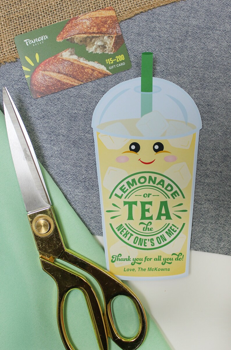 May include: A gift card for Panera Bread with a value of $15-200. The card features a picture of a loaf of bread. A cartoon illustration of a lemonade or tea drink with a smiling face and the text "Lemonade or Tea the next one's on me!"  Thank you for all you do! Love, The McKowns.
