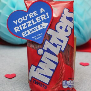 May include: A red bag of Twizzlers twists candy with a blue heart-shaped sticker that says "You're a rizzler! So have a..." and "Your Friend, Easton".