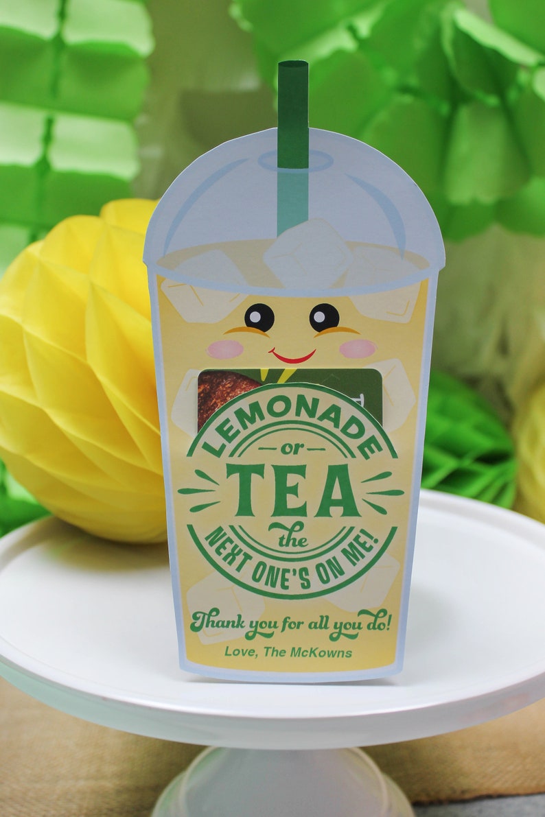 May include: A yellow and green illustrated card with a cartoon lemonade cup with a straw. The card says "Lemonade or Tea - The Next One's On Me!" and "Thank you for all you do! Love, The McKowns".