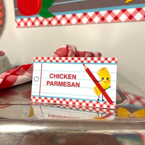 May include: A red and white checkered card with the text "CHICKEN PARMESAN" and a cartoon illustration of a piece of pasta with a smiling face holding a red pencil.