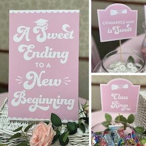 May include: Pink and white graduation party decorations with the text "A Sweet Ending to a New Beginning", "Commence-Mint is Sweet", and "Class Rings".