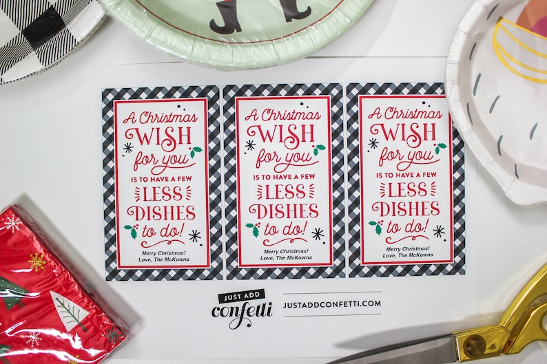 May include: Three printable gift tags with a black and white checkered background. The tags feature the text "A Christmas Wish for you is to have a few less dishes to do!" with red and green accents. The text "Merry Christmas! Love, The McKowns" is printed at the bottom of each tag.