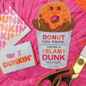 May include: A pink and orange Dunkin' Donuts gift card with a donut illustration and the text "Donut you know... you're a slam dunk teacher! Love, Sawyer".