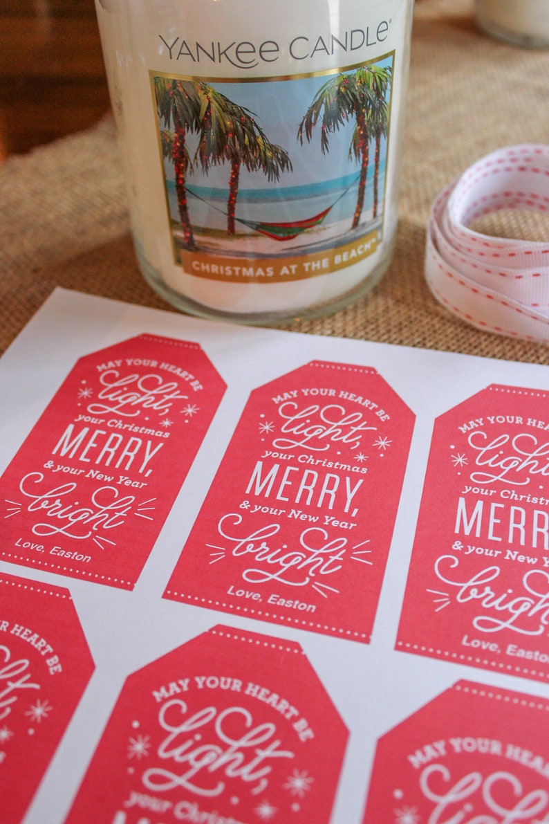 May include: Red gift tags with white text that reads "May your heart be light, your Christmas Merry, & your New Year bright."  Love, Easton.