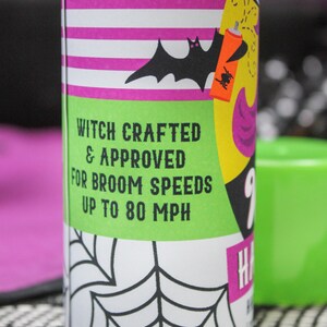May include: A green and yellow can with a black bat and spider design. The can has white stripes and the text "Witch Crafted & Approved for Broom Speeds Up to 80 MPH".