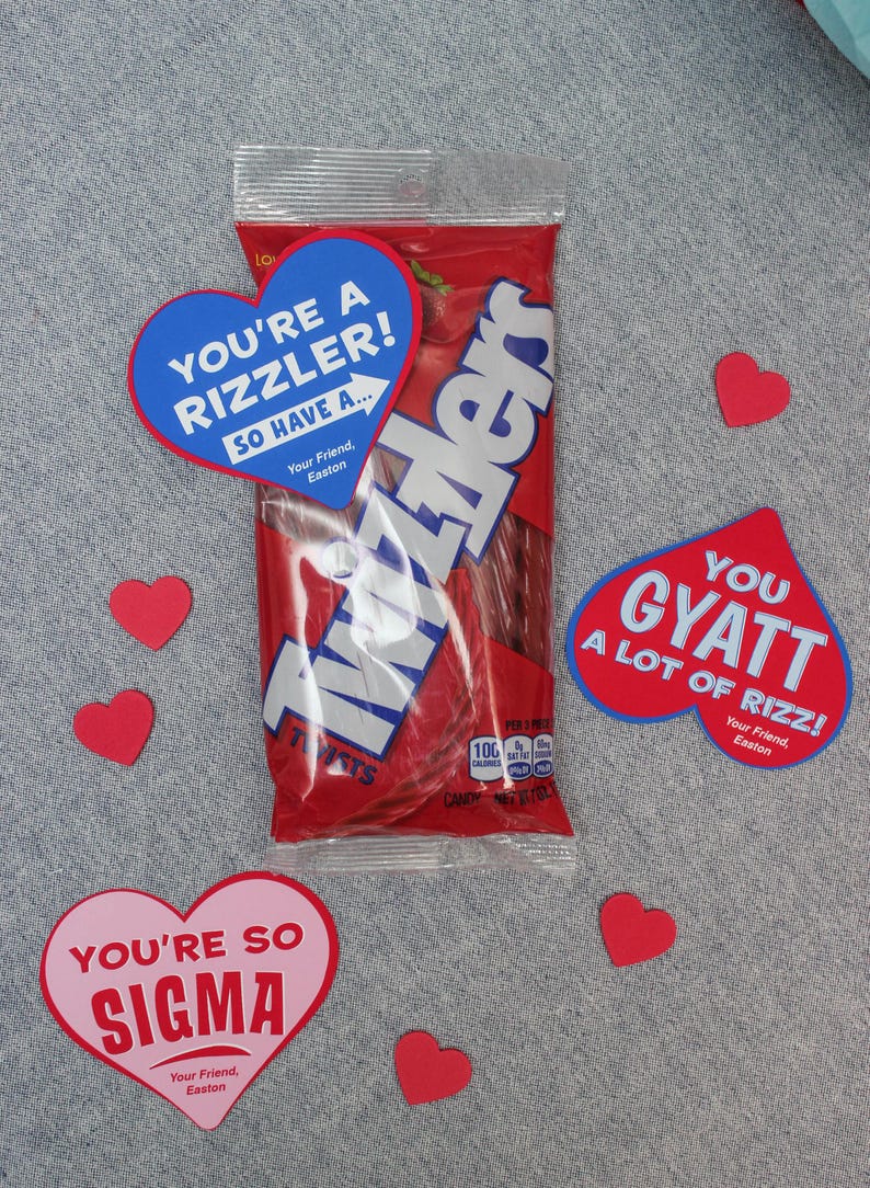 May include: A bag of red Twizzlers candy with three heart-shaped cards. The cards are blue, pink, and red with white text. The blue card says "You're a rizzler! So have a..." The pink card says "You're so sigma." The red card says "You gyatt a lot of rizz!" Each card has the text "Your friend, Easton".