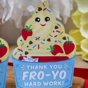 May include: A blue and red card shaped like a frozen yogurt cup with a smiling face and sprinkles. The card says "Thank You Fro-Yo Hard Work! Love, The McKowns".
