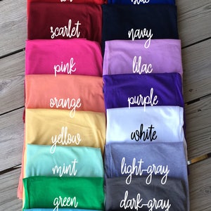 May include: A collection of tank tops in various colors, including red, blue, scarlet, navy, pink, lilac, orange, purple, yellow, white, mint, light gray, green, dark gray, light blue, and black.