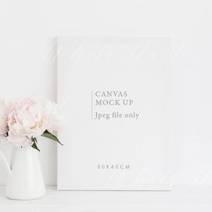 May include: A white canvas mockup with the text "CANVAS MOCK UP" and "Jpeg file only" in gray text. The canvas is 30x40 cm. A vase with pink peonies sits in front of the canvas.