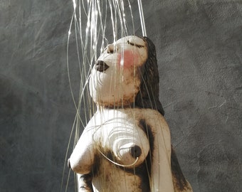 Ceramic Lady in the shower with a pair of hand carved wood slippers