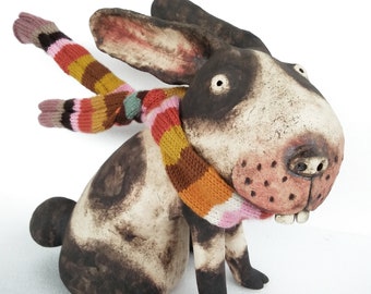 Ceramic Rabbit in the wind with a Hand Knitted Striped Scarf