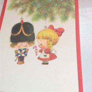 Vintage Christmas card soldier and doll unused+env