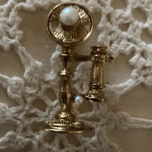 Vintage old fashioned telephone brooch gold tone