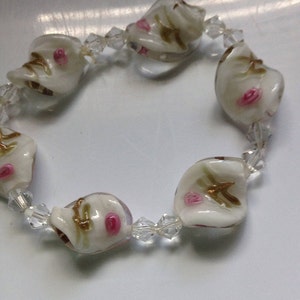 Handblown stretch glass bracelet beaded with rosettes