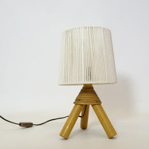 Little table lamp with a braided shade.