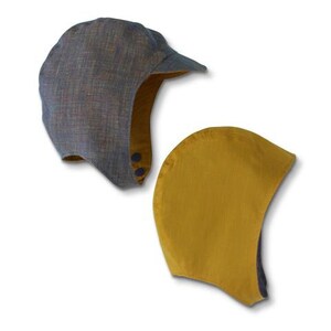 May include: Two fabric hats, one with a blue and brown pattern and a brim, and the other a solid yellow color.