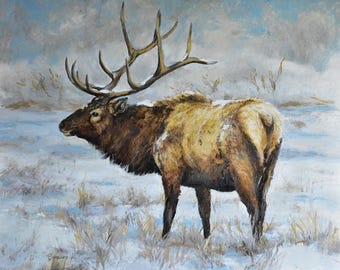 May include: A large, brown elk with a large set of antlers stands in a snowy field. The elk is facing to the left, and its antlers are covered in snow. The background is a blurry, snowy landscape.