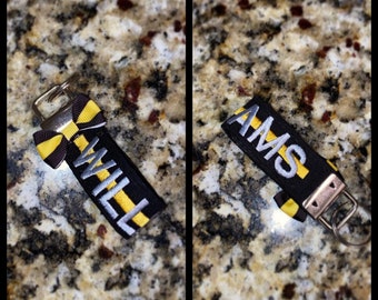 911 Dispatcher Keyfob- Dunne Goud/Gele Lijn