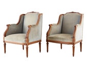 Pair of French Louis XVI Style Walnut Bergère A Oreilles