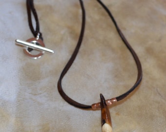 Wolf tooth necklace on a deerskin leather cord. Wolf tooth necklace, wolf tooth jewelry, animal tooth necklace, wolf tooth, wolf necklace