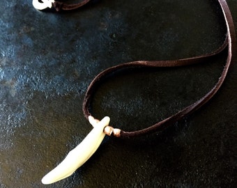 White Wolf tooth on a dark brown deerskin leather cord. Wolf tooth necklace, wolf tooth jewelry, animal tooth necklace, wolf tooth, wolf