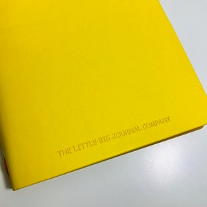 Bright Yellow Faux Leather Wrap A5 Refillable Journal Notebook bright yellow with plain pages inserts. image 4