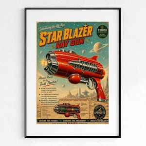 May include: A framed vintage-style poster featuring a red ray gun titled Star Blazer Ray Gun. The artwork includes text about atomic power, a technical diagram of the weapon, and a space-themed background with planets and a futuristic landscape.