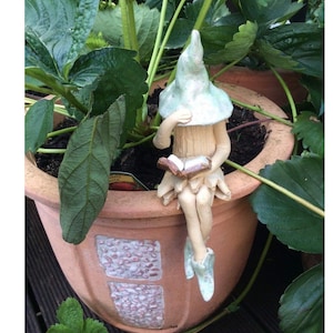Fairy garden book fairy, handmade ceramic plant pot ornament.