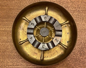 SHIP WHEEL ASHTRAY…Chase…P.A.…Spinning Wheel…Numbered…Brass…5 1/4”Diameter… 116974…1960s #585