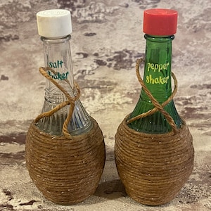 CORDED SHAKERS…Salt Pepper Shakers…Textured Clear and  Green….Wrapped in Braided Cord…Lettered…Plastic Caps…1960s #553